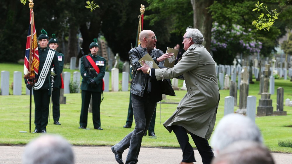 Canadian Ambassador to Ireland Kevin Vickers wrestles with a protester during a State ceremony to remember the British soldiers who died during the Easter Rising in Dublin, May 26, 2016. (Photo by Brian Lawless/PA Wire/AP)