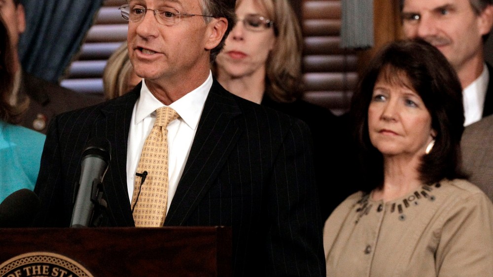 In this Jan. 10, 2012 file photo, Rep. Sheila Butt, lower right, listens as Gov. Bill Haslam talks in Nashville, Tenn. The Tennessee Legislative Black Caucus said Butt should apologize for a Facebook post they say is racist. (Photo by Mark Humphrey/AP)