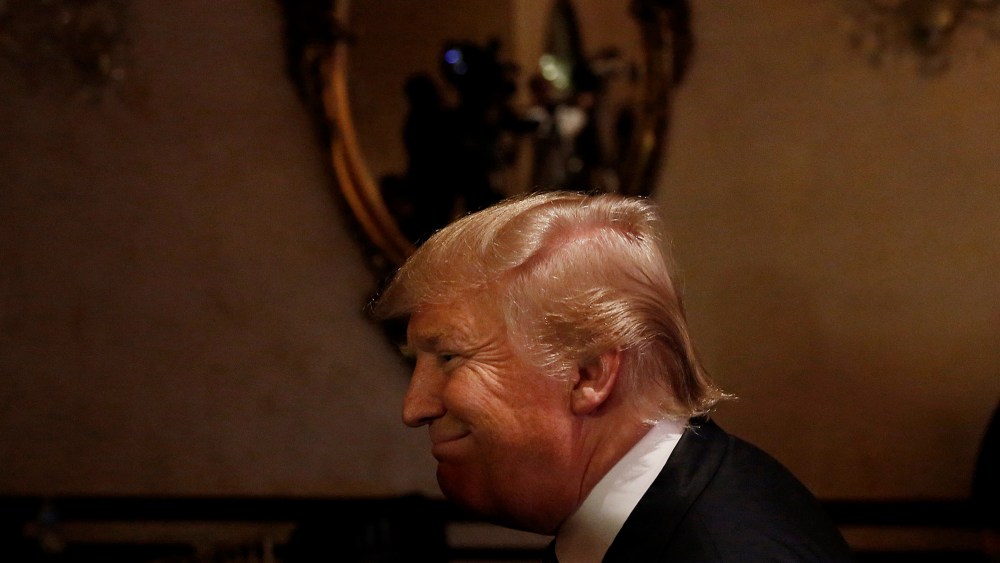 Republican presidential candidate Donald Trump walks away from the stage after he speaks during a press conference, March 5, 2016, in West Palm Beach, Fla. (Photo by Brynn Anderson/AP)