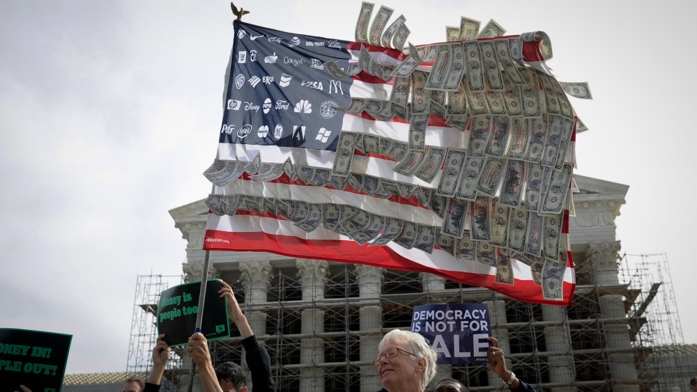 Demonstrators gather outside the Supreme Court in Washington on Oct. 8, 2013, as the court heard arguments on campaign finance. (Susan Walsh/AP)