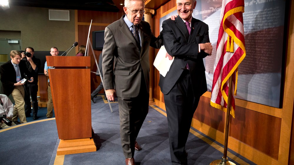 Senate Majority Leader Harry Reid of D-Nev., left, and Sen. Charles Schumer, D-N.Y., leave a news conference on Capitol Hill in Washington on Nov. 21, 2013.