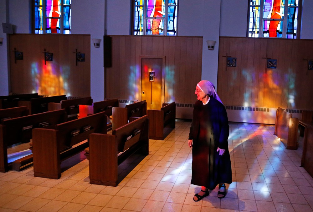 Mother Patricia Mary walks in the chapel at the Mullen Home for the Aged, run by Little Sisters of the Poor, Jan. 2, 2014, in Denver, Colo.