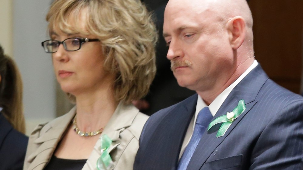 Former Arizona Rep. Gabrielle Giffords and her husband Mark Kelly watch President Barack Obama's State of the Union address during a joint session of Congress on Capitol Hill in Washington, Tuesday Feb. 12, 2013. (Photo by Pablo Martinez Monsivais/AP...