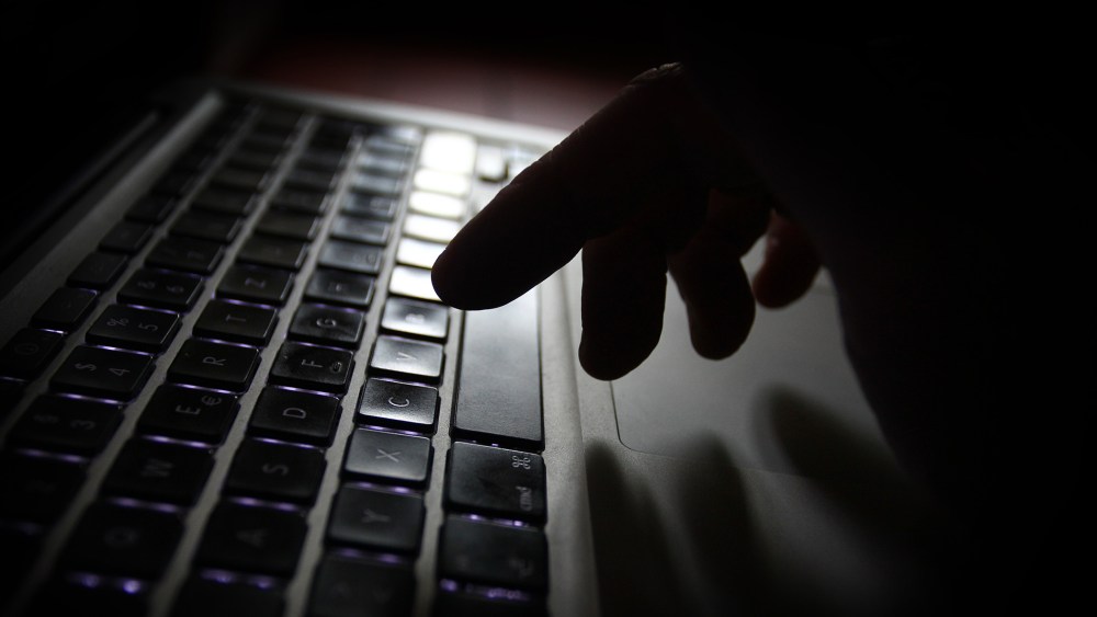 A person man uses a laptop. (Karl-Josef Hildenbrand/dpa/AP)