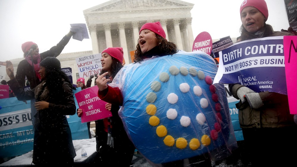 Margot Riphagen of New Orleans, La., wears a birth control pills costume as she protests in front of the Supreme Court in Washington, on March 25, 2014.