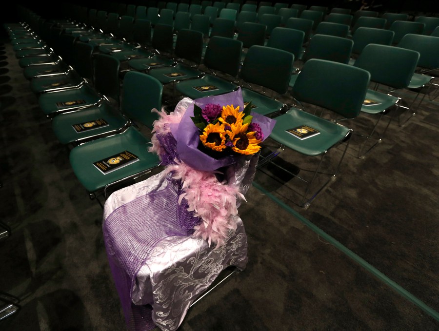 A seat for Hadiya Pendleton is decorated before graduation ceremonies for the Class of 2015 at King College Prep, held on the campus of Chicago State University, June 9, 2015, in Chicago. (Photo by Charles Rex Arbogast/AP)