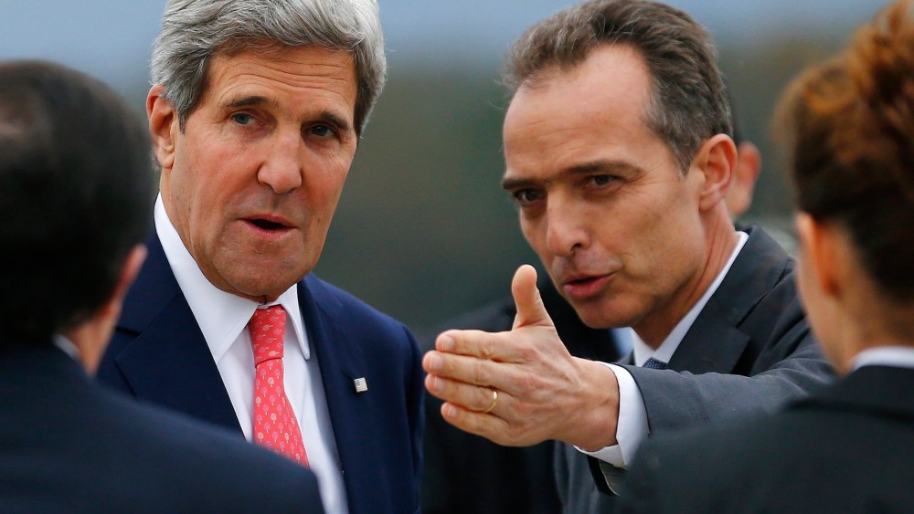 Jean-Luc Chopard, Geneva head of Protocol, right, welcomes US Secretary of State John Kerry, left, at his arrival for closed-door nuclear talks at the United Nations offices in Geneva, Switzerland, Friday, Nov. 8, 2013.