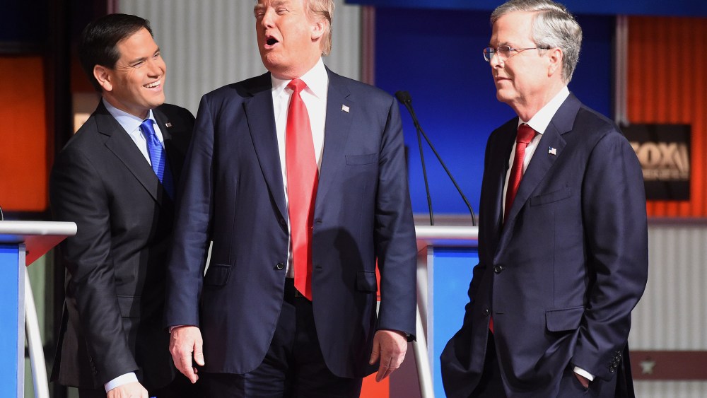 Republican presidential candidates Donald Trump, Sen. Marco Rubio, R-Fla. and Jeb Bush speak at a break during the Fox Business Network Republican presidential debate at the North Charleston Coliseum, Jan. 14, 2016. (Photo by Rainier Ehrhardt/AP)