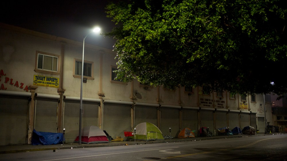 Tents set up by homeless people sit in front of a building on Skid Row, Feb. 4, 2015, in Los Angeles, Calif. (Photo by Jae C. Hong/AP)
