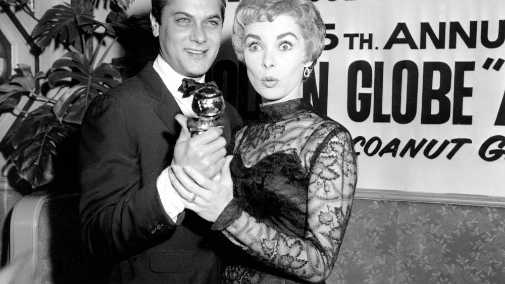 Tony Curtis holds his Golden Globe award for World Male Film Favorite as his wife, actress Janet Leigh, gives a look of surprise at the Hollywood Foreign Press Association awards dinner at the Coconut Grove in Hollywood, Calif., Feb. 26, 1958. Curtis...