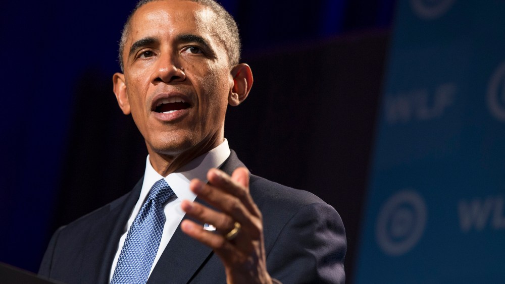 President Barack Obama gestures during remarks at the Democratic National Committee's Women's Leadership Forum on Sept. 19, 2014, in Washington, D.C. (Photo by Evan Vucci/AP)