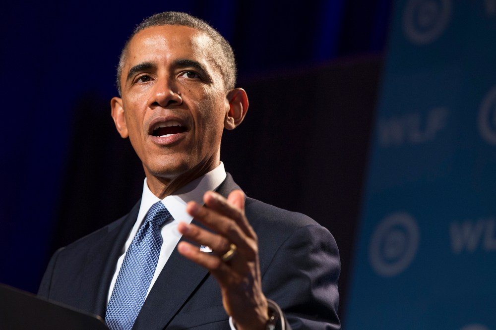 President Barack Obama gestures during remarks at the Democratic National Committee's Women's Leadership Forum on Sept. 19, 2014, in Washington, D.C. (Photo by Evan Vucci/AP)