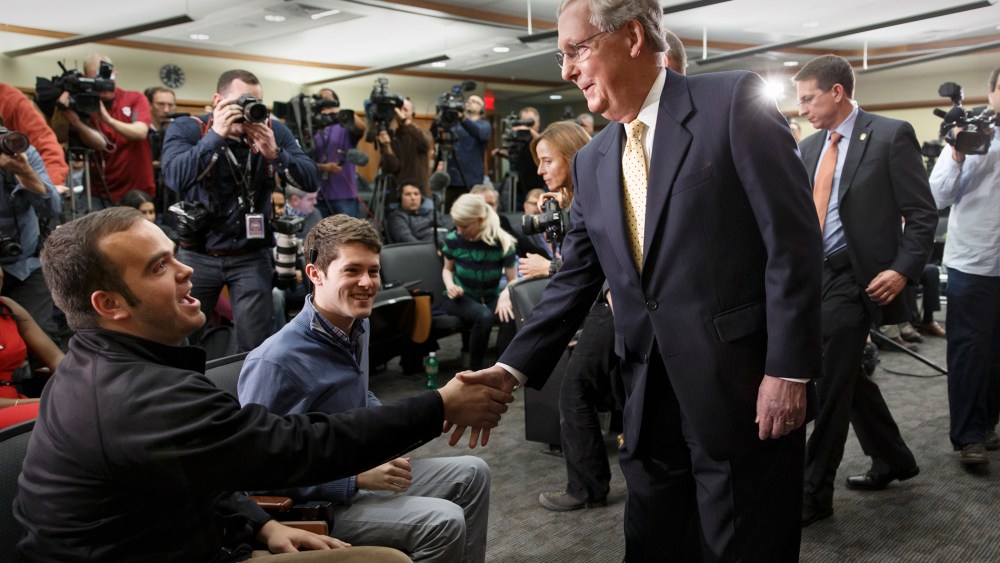 Senate Republican leader Mitch McConnell of Kentucky shakes hands with students at the University of Louisville's McConnell Center for political studies on Nov. 5, 2014. (J. Scott Applewhite/AP)