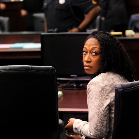 Marissa Alexander looks back to the gallery while the lawyers involved in the case have a sidebar discussion with Judge James Daniel Wednesday, April 2, 2014. (Photo by Bob Mack/The Florida Times-Union/AP)