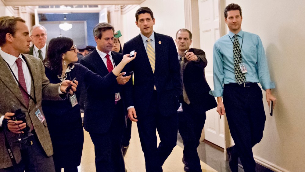 House Budget Committee Chairman Rep. Paul Ryan, R-Wis., center, is pursued by reporters on Capitol Hill in Washington on Thursday, Oct. 10, 2013