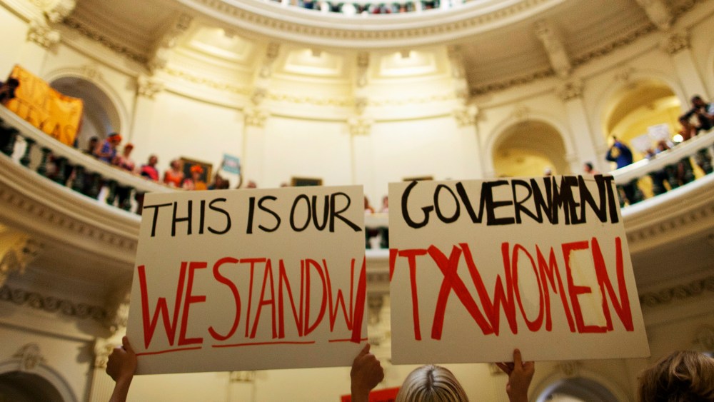 In this July 12, 2013 file photo, abortion rights supporters rally on the floor of the State Capitol rotunda in Austin, Texas.