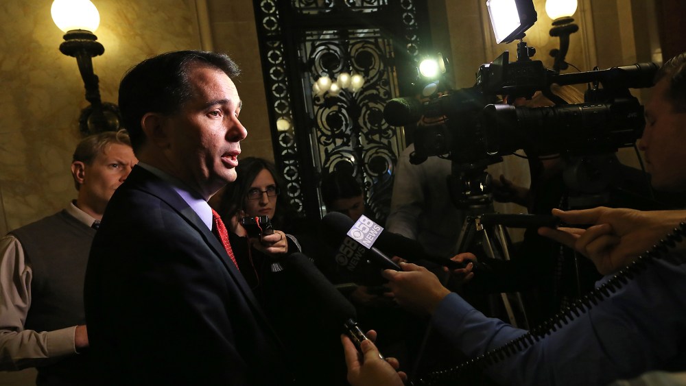 Wisconsin Gov. Scott Walker speaks to members of the media at the Wisconsin State Capitol building in Madison, Wis. on Oct. 6, 2014. (Photo by John Hart/Wisconsin State Journal/AP)