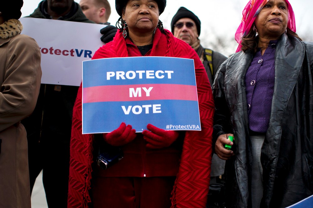 People wait in line outside the Supreme Court in Washington, Wednesday, Feb. 27, 2013, to listen to oral arguments in the Shelby County, Ala., v. Holder voting rights case.