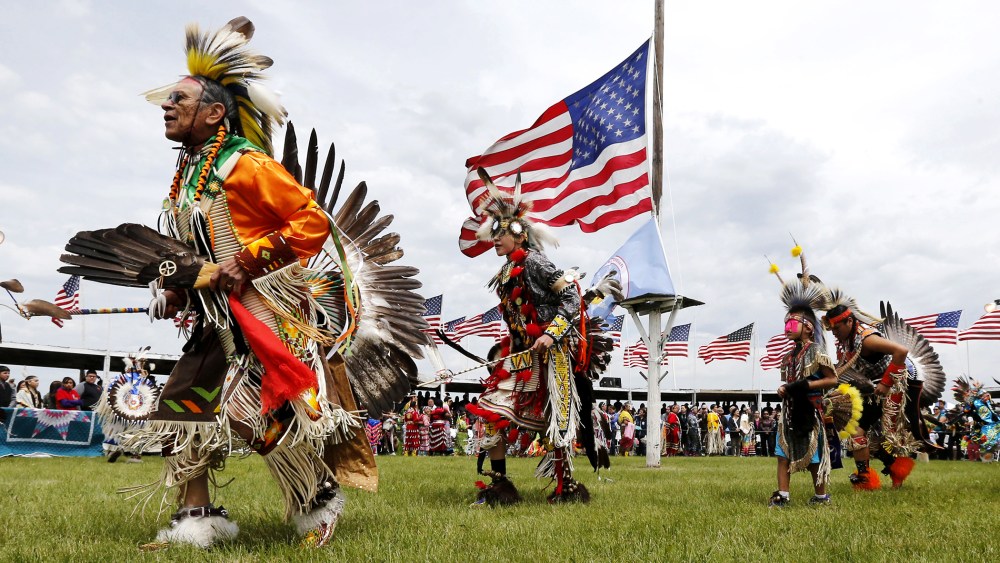 Native American dancers from more than 20 reservations in North and South Dakota perform before the arrival of President Barack Obama and first lady Michelle Obama on the Standing Rock Indian Reservation Friday, June 13, 2014, in Cannon Ball, N.D.