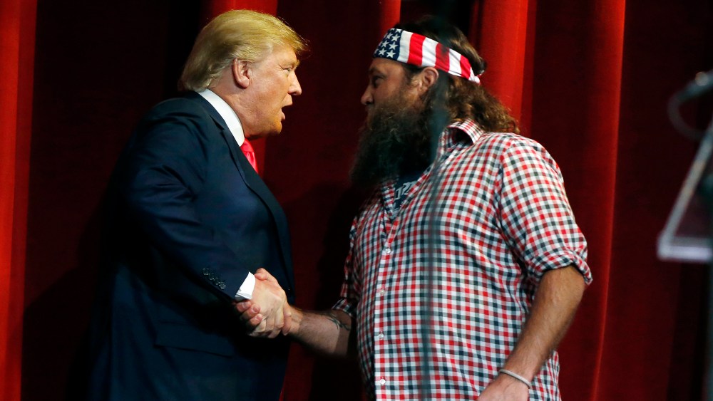 Willie Robertson welcomes Republican presidential candidate Donald Trump to the stage during the Outdoor Channel and Sportsman Channel's 16th annual Outdoor Sportsman Awards, Jan. 21, 2016, in Las Vegas. (Photo by Isaac Brekken/AP)