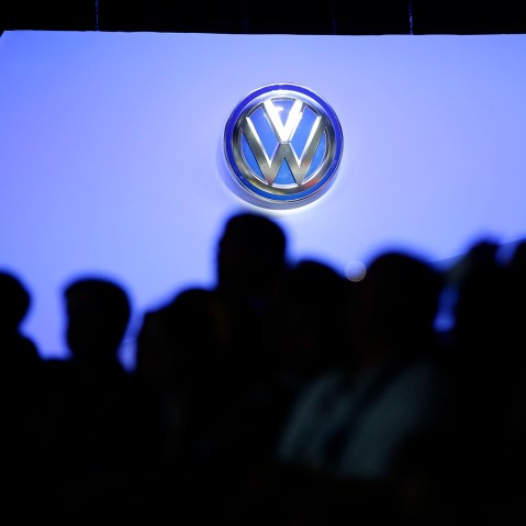 The Volkswagen logo is displayed as people gather at the Los Angeles Auto Show, Nov. 20, 2013, in Los Angeles, Calif.  (Photo by Jae C. Hong/AP)