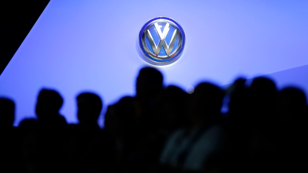 The Volkswagen logo is displayed as people gather at the Los Angeles Auto Show, Nov. 20, 2013, in Los Angeles, Calif.  (Photo by Jae C. Hong/AP)