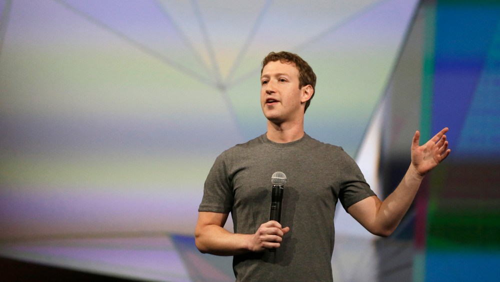 Facebook CEO Mark Zuckerberg gestures while delivering the keynote address at the f8 Facebook Developer Conference, April 30, 2014, in San Francisco, Calif.