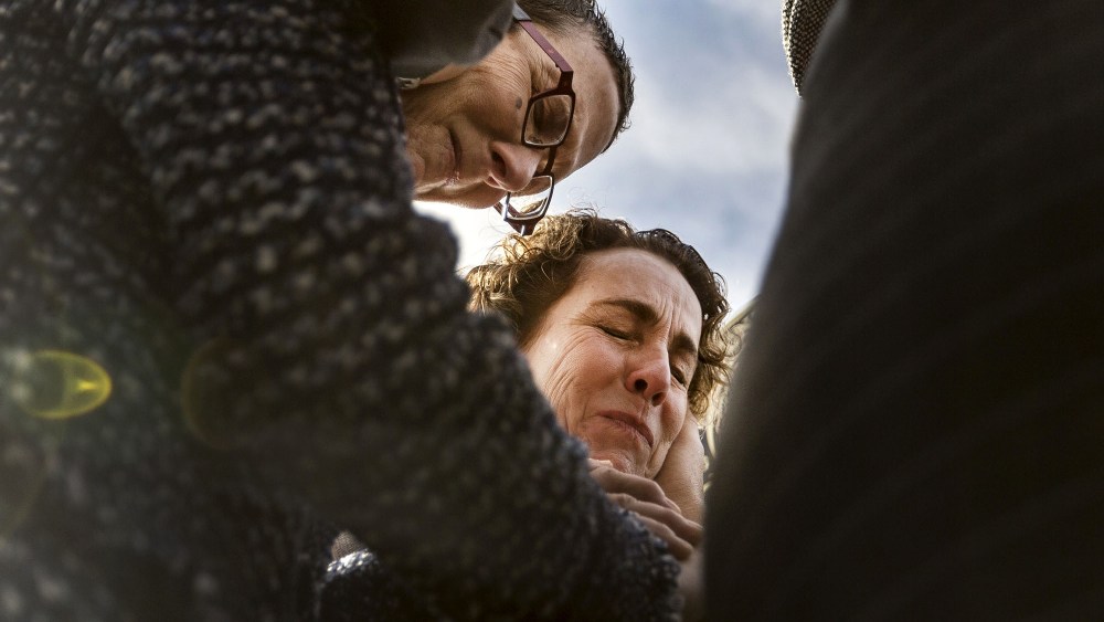 Suzanne Bryant, left, and Sarah Goodfriend pray over their marriage vows with Rabbi Kerry Baker outside of the Travis County Clerk's office in Austin, Texas on Feb. 19, 2015. (Photo by Austin American-Statesman, Ricardo B. Brazziell/AP)