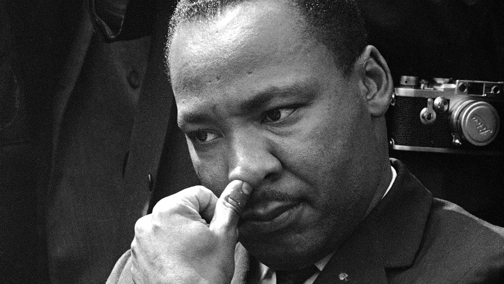 Dr. Martin Luther King Jr., Atlanta integration leader, touches his nose as he ponders a question during a news conference in Birmingham, Alabama, Sept. 16, 1963. King said he and other leaders have called for federal Army occupation of Birmingham,...