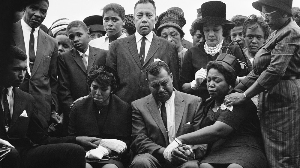 The family of Carole Robertson, a 14-year-old African American girl killed in a church bombing, attend graveside services for her, Sept. 17, 1963, Birmingham, Ala. (Photo by Horace Cort/AP)