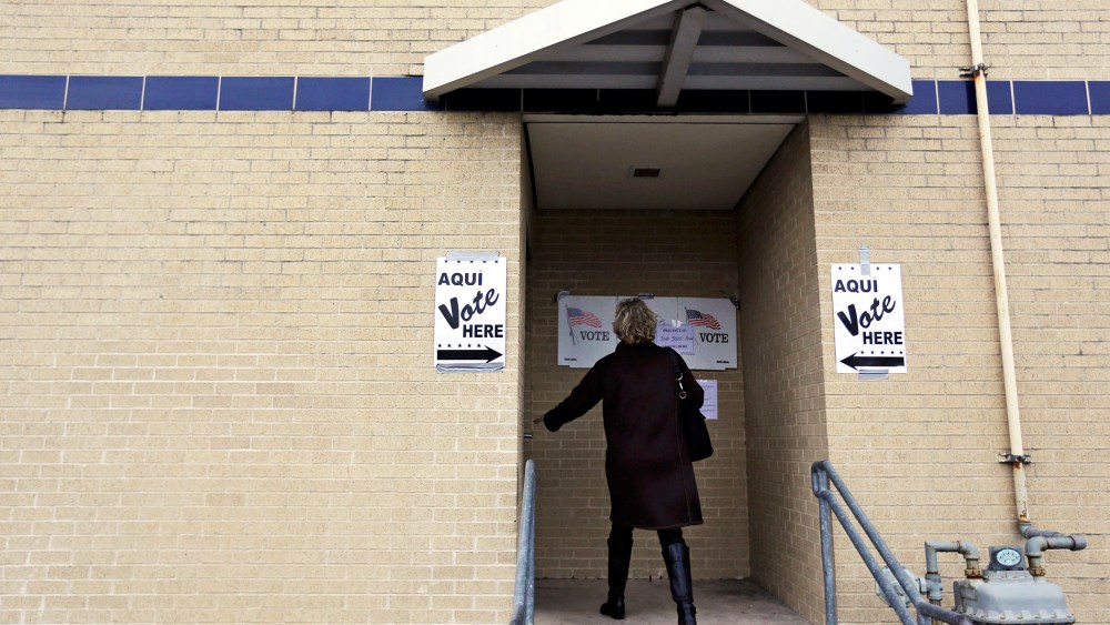A voter arrives at a polling site, Tuesday, March 4, 2014, in San Antonio.