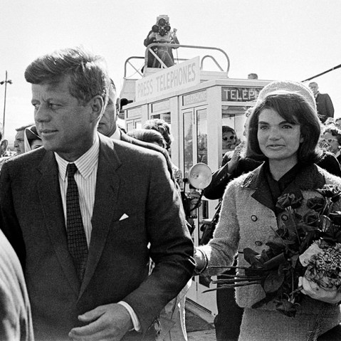 President John F. Kennedy and his wife Jacqueline Kennedy are greeted by an enthusiastic crowd upon their arrival at Dallas Love Field, on November 22, 1963. Only a few hours later the president was assassinated while riding in an open-top limousine...