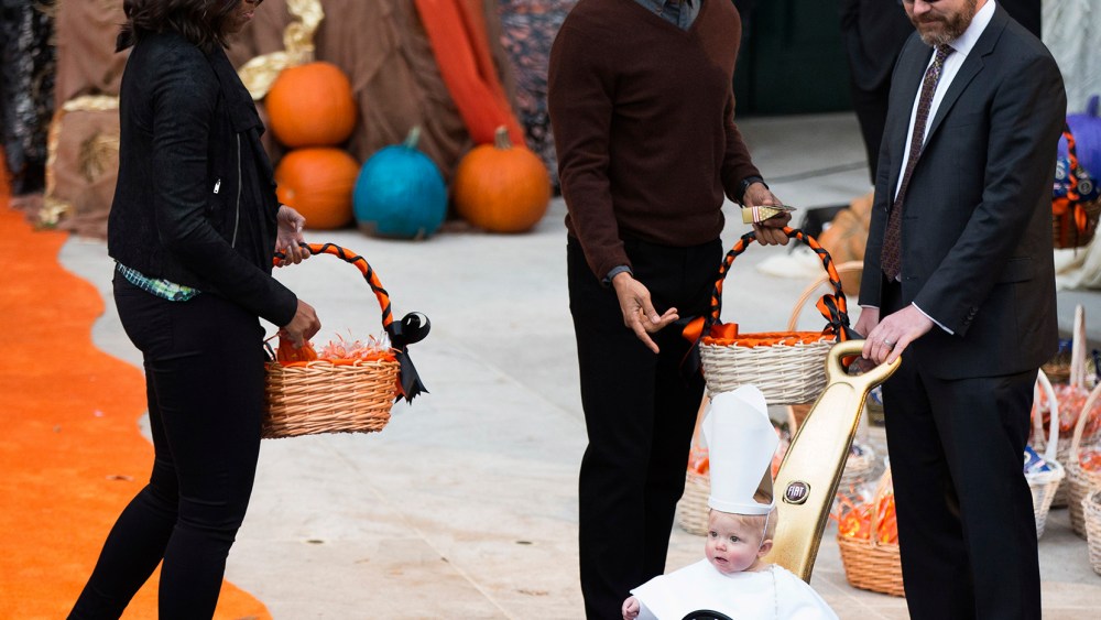 President Barack Obama and first lady Michelle Obama greet a child dressed as the pope during Halloween festivities at the South Portico of the White House in Washington, Oct. 30, 2015. (Photo by Andrew Harnik/AP)
