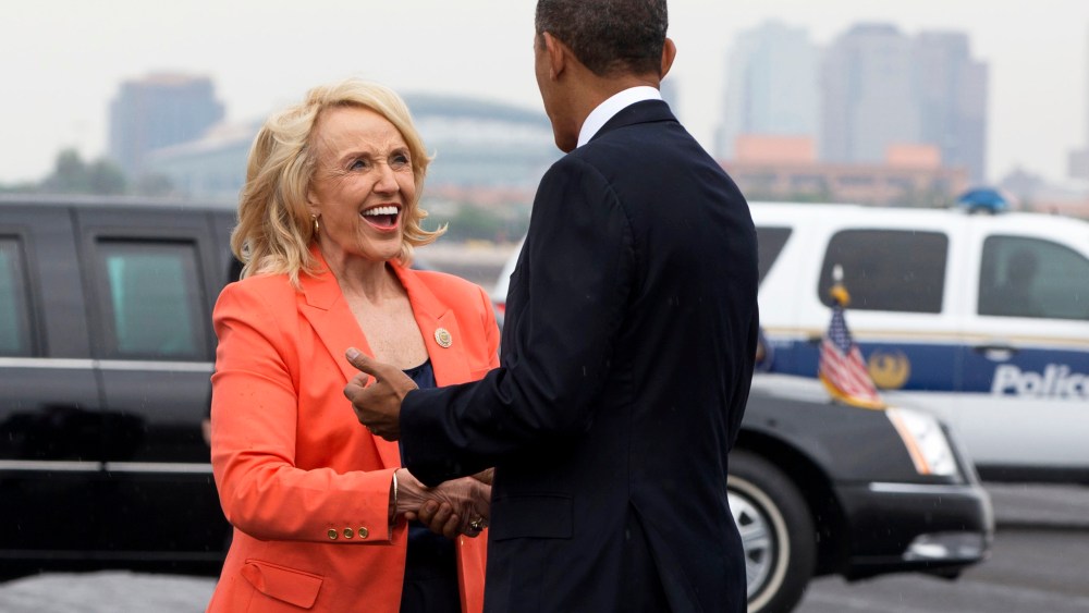 Arizona Gov. Jan Brewer greets President Barack Obama on his arrival in Phoenix, Tuesday, Aug. 6, 2013.