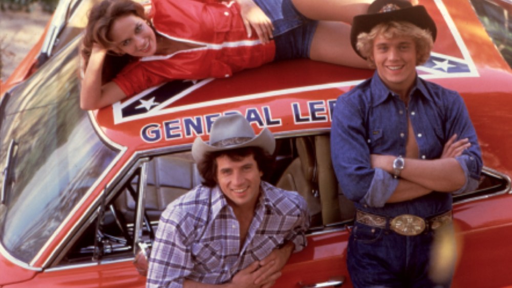 The Dukes Of Hazzard, Catherine Bach, Tom Wopat, John Schneider are seen with the famous General Lee car. (Photo by Moviestore Collection/Rex Features/AP)
