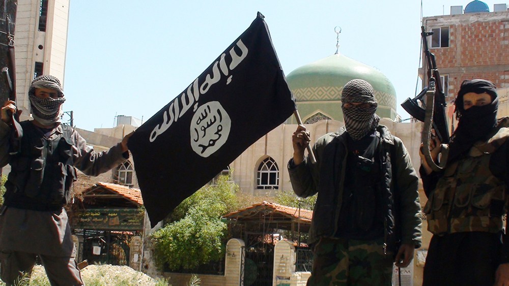 A photo posted online on April 7, 2015 shows ISIS or "Islamic State" group militants posing in Yarmouk (Yarmuk) Palestinian camp, located in a suburb of Damascus, Syria, that is partially now under their control. (Photo by Balkis Press/Sipa USA/AP)