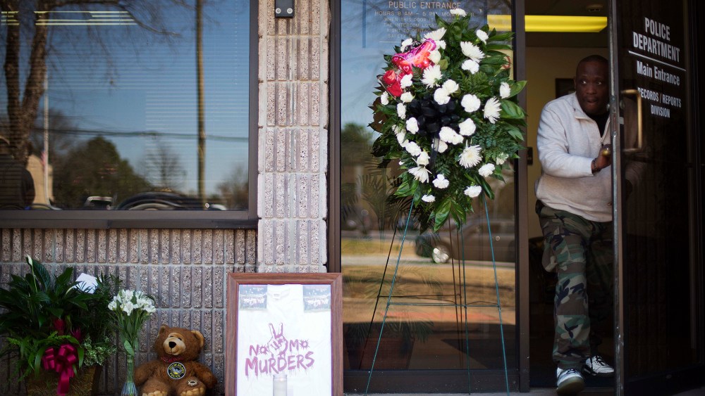 A makeshift memorial stands outside the Riverdale police station the day after Maj. Greg Barney, a 25-year veteran, died while helping other officers serve a 'no knock' warrant in a drug case, Feb. 12, 2016, in Riverdale, Ga. (Photo by David Goldman/AP)