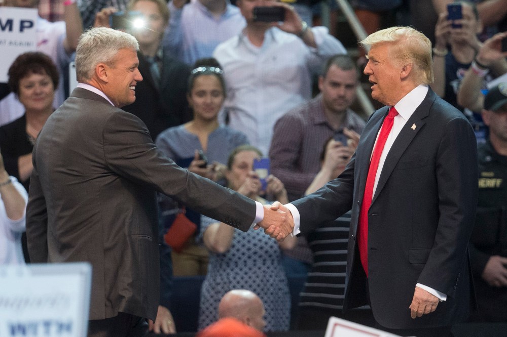 Buffalo Bills head coach Rex Ryan, left, shakes hands with Republican presidential candidate Donald Trump, after introducing him during a campaign stop at the First Niagara Center, April 18, 2016, in Buffalo, N.Y. (Photo by John Minchillo/AP)