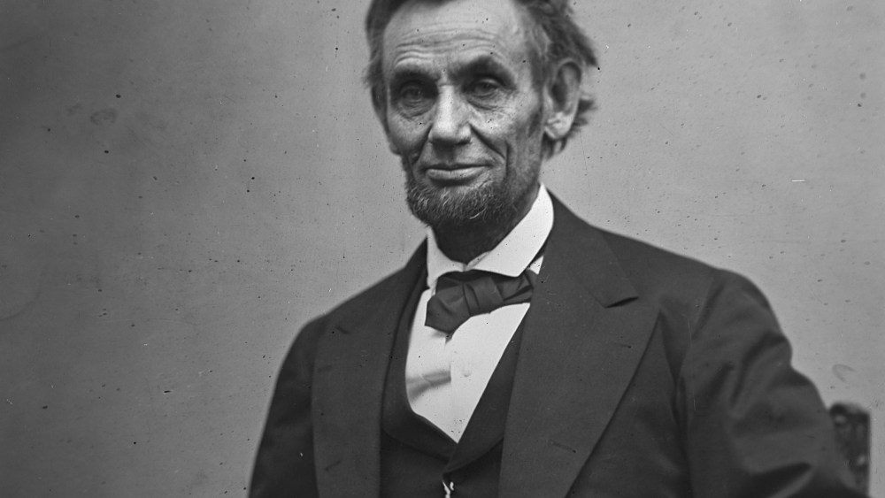File Photo: In this photo provided by the Library of Congress, President Abraham Lincoln, seated and holding his spectacles and a pencil on Feb. 5, 1865. (Photo by Alexander Gardner/AP Photo/Library of Congress, File)