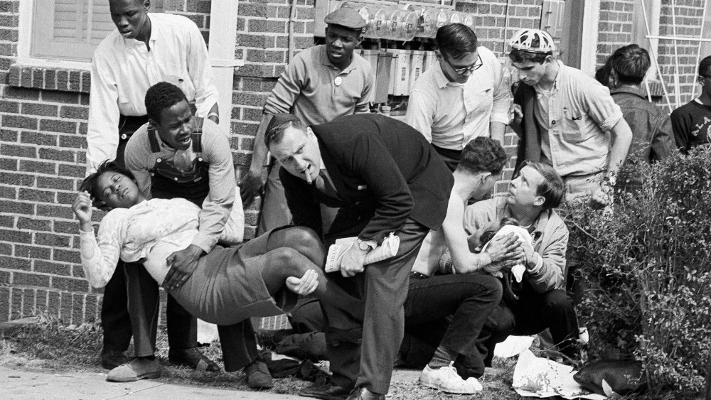 Mrs. S.W. Boynton is aided by two men after she was injured when state police broke up a demonstration march in Selma, Ala. on Bloody Sunday, March 7, 1965.