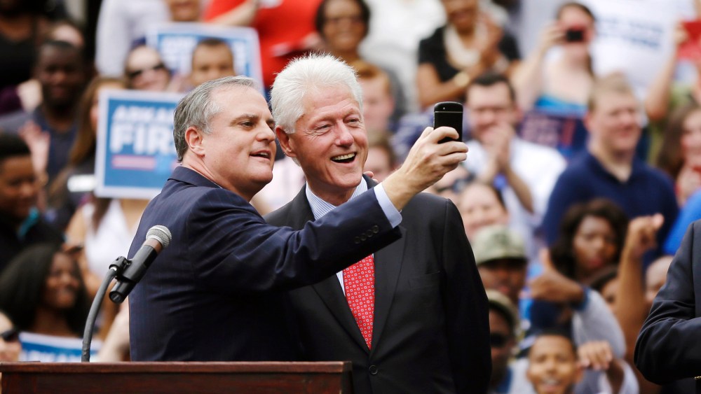 U.S. Sen. Mark Pryor, D-Ark., left, takes a selfie with former President Bill Clinton during a rally for Democrats at the University of Central Arkansas in Conway, Ark., Oct. 6, 2014.