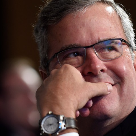 Former Florida Gov. Jeb Bush listens to a speaker before giving his keynote address at the National Summit on Education Reform in Washington on Nov. 20, 2014. (Susan Walsh/AP)