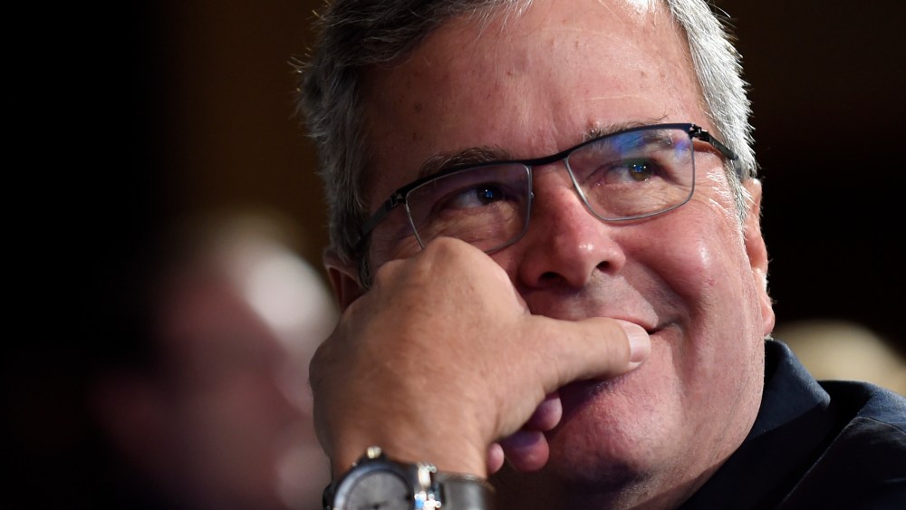 Former Florida Gov. Jeb Bush listens to a speaker before giving his keynote address at the National Summit on Education Reform in Washington on Nov. 20, 2014. (Susan Walsh/AP)