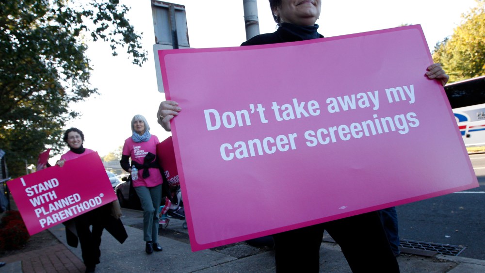 Planned Parenthood supporters demonstrate outside of Hofstra University the site of the presidential debate, Tuesday, Oct. 16, 2012, Hempstead, N.Y. President Obama and Republican presidential candidate, former Massachusetts Gov. Mitt Romney will hold...