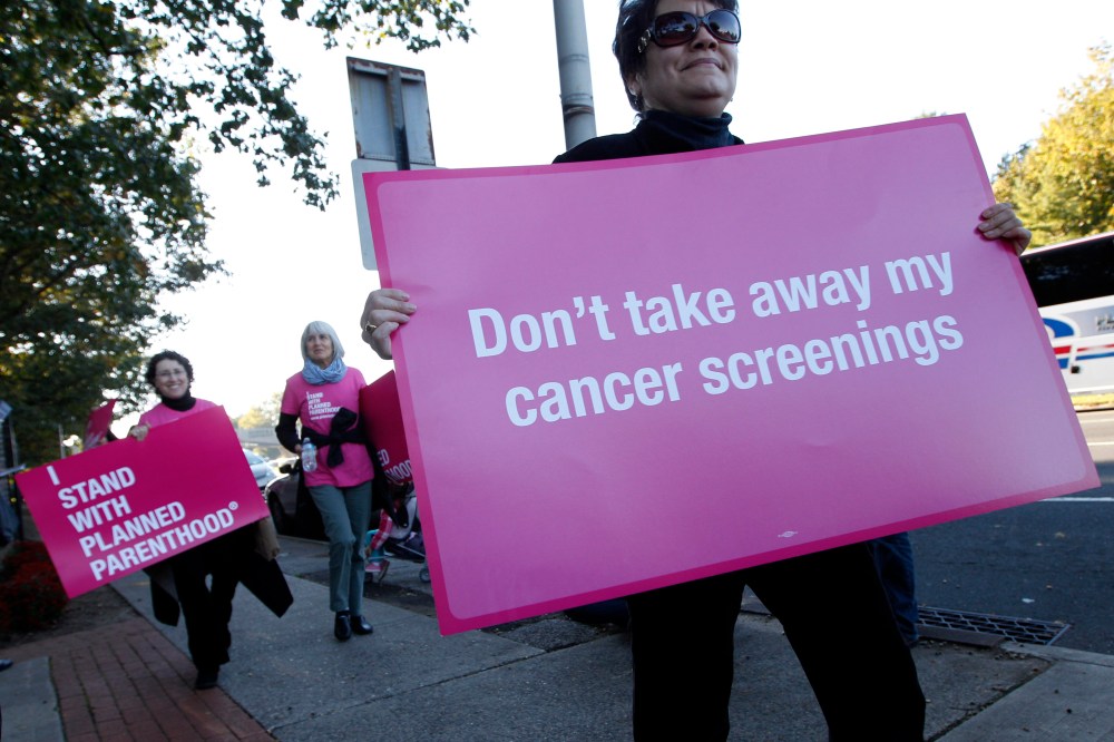 Planned Parenthood supporters demonstrate outside of Hofstra University the site of the presidential debate, Tuesday, Oct. 16, 2012, Hempstead, N.Y. President Obama and Republican presidential candidate, former Massachusetts Gov. Mitt Romney will hold...