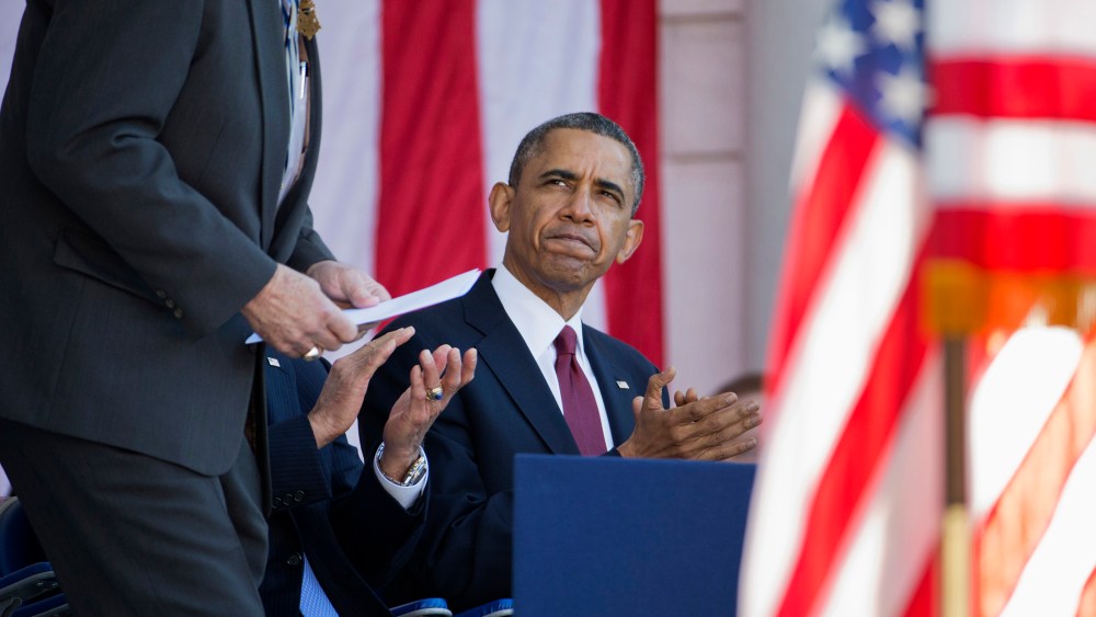 President Barack Obama applauds as Harold Fritz, president of the Congressional Honor Society