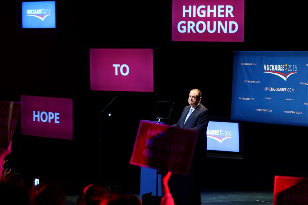 Former Arkansas Gov. Mike Huckabee is cheered by supporters, May 5, 2015, in Hope, Ark., after announcing that he is running for the Republican presidential nomination. (Photo by Danny Johnston/AP)