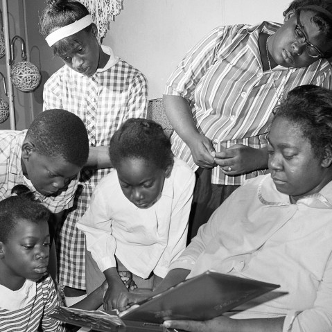 Exerlena Jackson, widow of Wharlest Jackson, ex-treasurer of the Natchez NAACP, who was killed by a bomb blast in his pickup truck, is shown with her family. (Photo by AP)