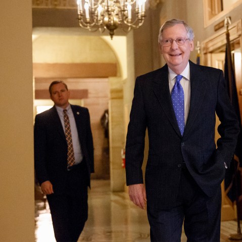 Senate Minority Leader Mitch McConnell of Ky. smiles as he arrives for a meeting of Senate Republicans on Nov. 13, 2014. (J. Scott Applewhite/AP)