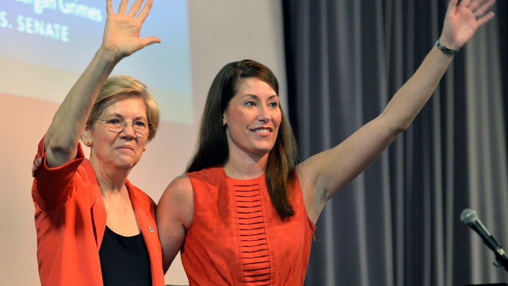 Democratic U.S. Sen. Elizabeth Warren, left, of Massachusetts and Kentucky democratic Senatorial candidate Alison Lundergan Grimes wave to supporters at at rally on Sunday, June 29, 2014 at the University of Louisville in Louisville, Ky.